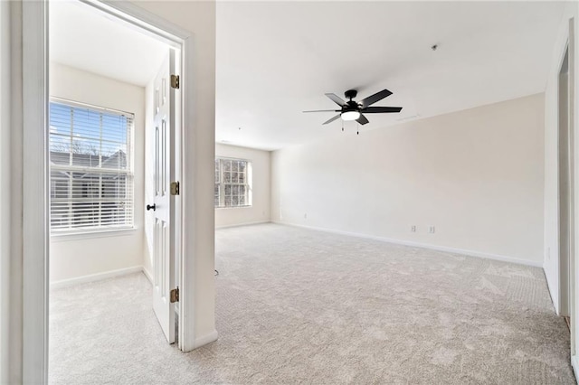 carpeted empty room with ceiling fan