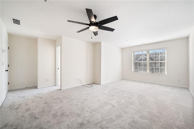 empty room featuring light carpet and ceiling fan