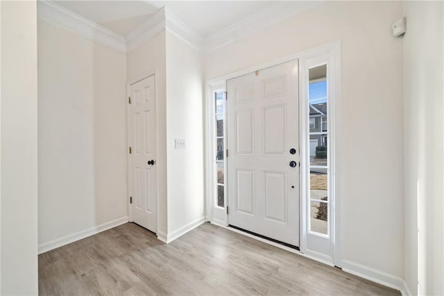 entrance foyer featuring crown molding and light hardwood / wood-style flooring