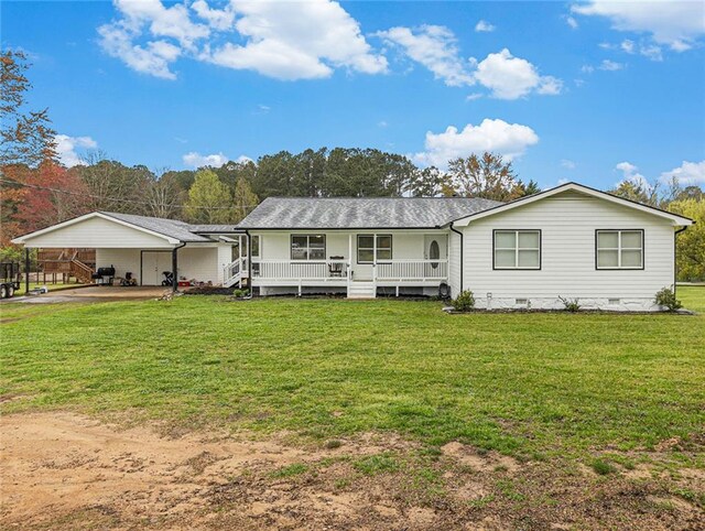 back of house with covered porch, a yard, a carport, and crawl space