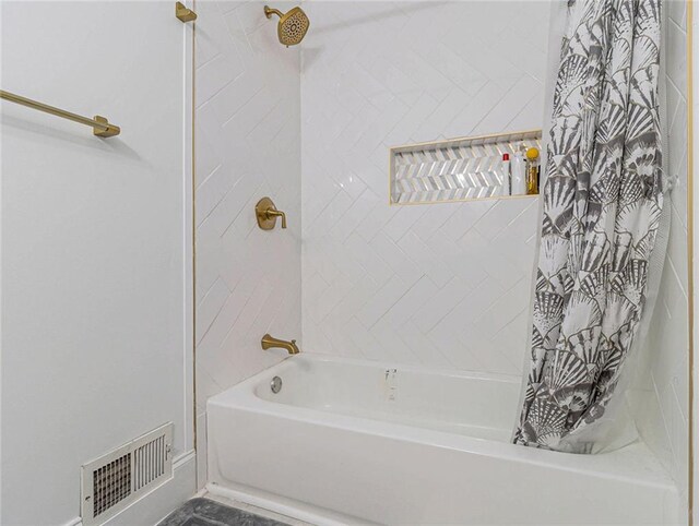 full bathroom featuring shower / bath combo and visible vents