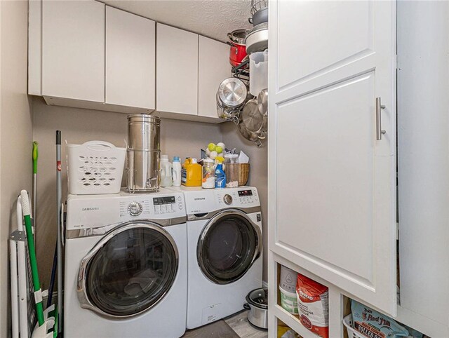 clothes washing area with cabinet space and independent washer and dryer