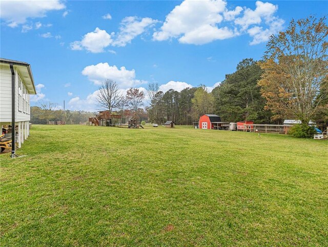 view of yard with an outbuilding and a shed