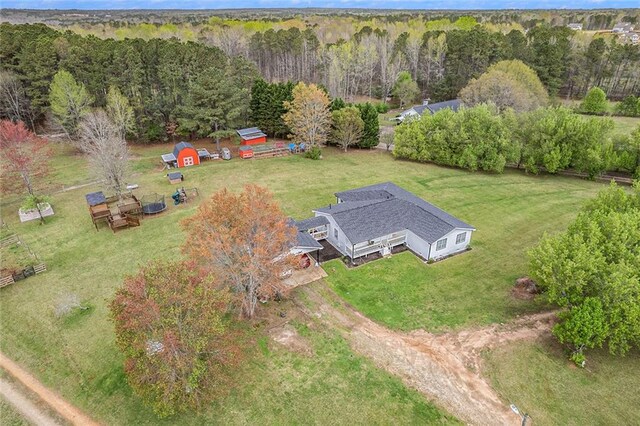 aerial view featuring a wooded view