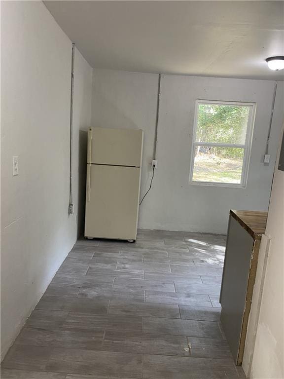 unfurnished dining area featuring wood finished floors
