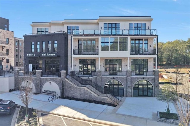 8200 Main St S Unit 1306, Woodstock, GA 30188 - view of front of house with stucco siding and a balcony