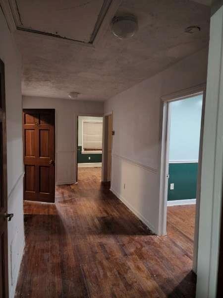 hall featuring dark wood-type flooring