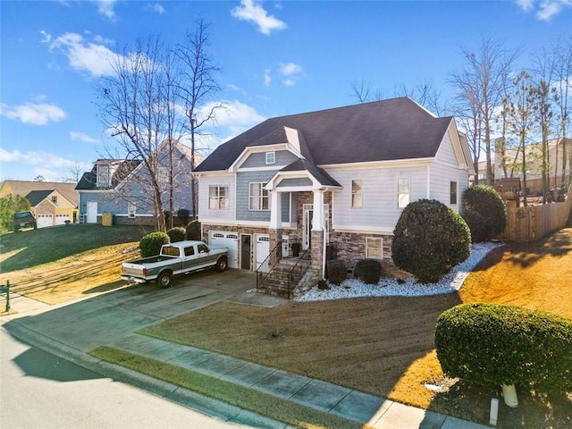 view of front of home featuring a garage and a front yard