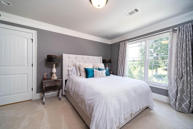 carpeted bedroom with crown molding