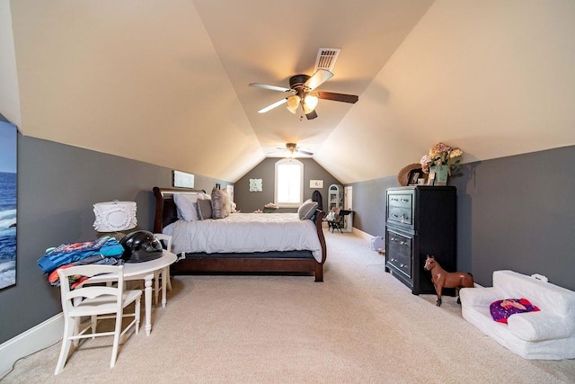 bedroom featuring ceiling fan, vaulted ceiling, and light colored carpet