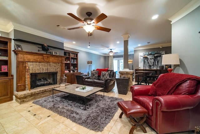 tiled living room featuring ceiling fan, crown molding, built in shelves, and a brick fireplace