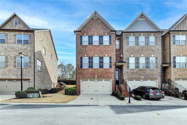 view of property with concrete driveway, brick siding, and an attached garage