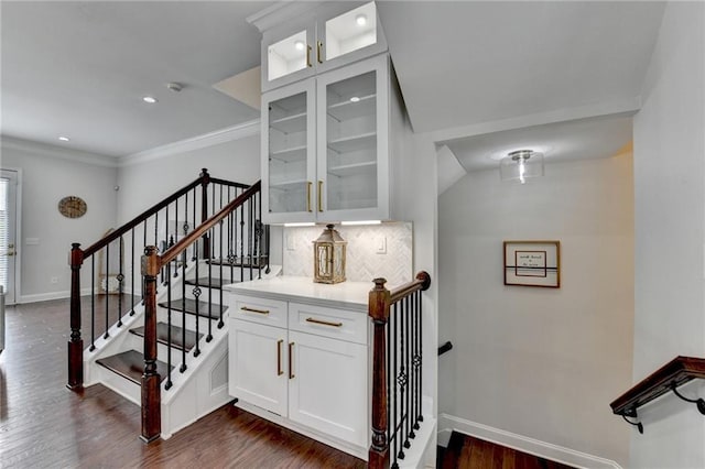 stairs featuring crown molding, recessed lighting, wood finished floors, and baseboards