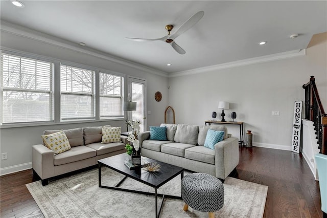 living area with dark wood-style flooring, crown molding, and baseboards