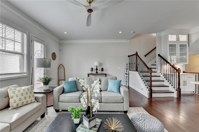 living area with ornamental molding, recessed lighting, wood finished floors, and stairs