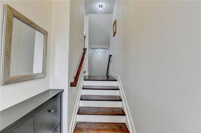 staircase featuring baseboards