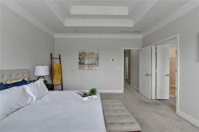 bedroom featuring carpet floors, a tray ceiling, and baseboards