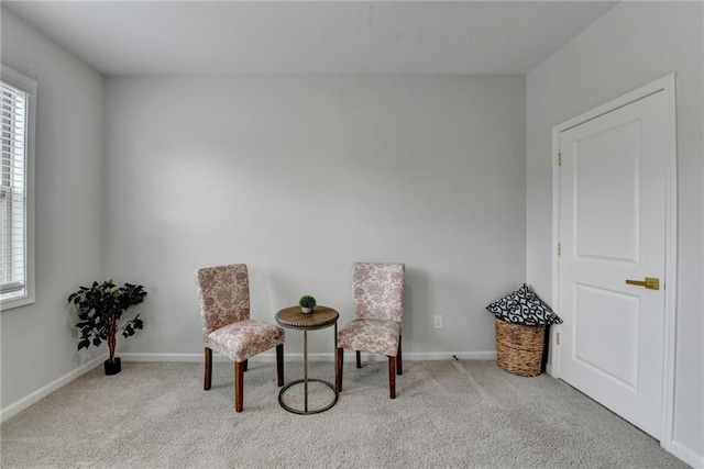 sitting room with carpet flooring and baseboards