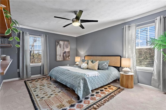 carpeted bedroom with ceiling fan, a textured ceiling, and ornamental molding