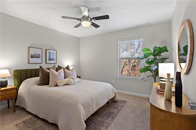 bedroom featuring light carpet and ceiling fan