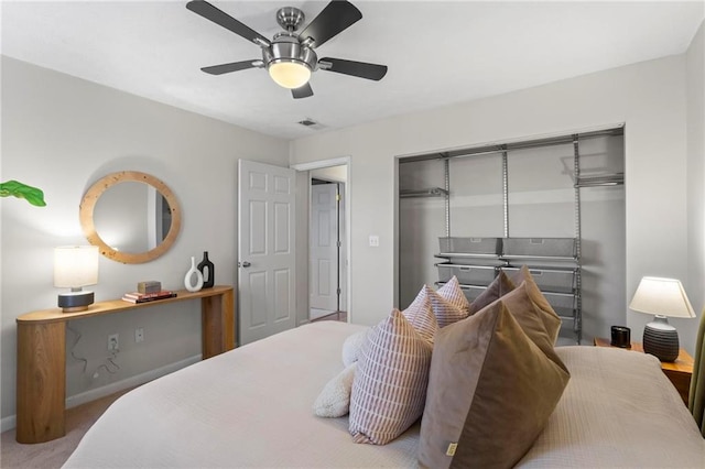 bedroom featuring ceiling fan, a closet, and carpet