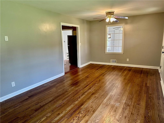 1468 Spruce Dr SE, Smyrna, GA 30080 - spare room featuring ceiling fan, dark wood-type flooring, and baseboards