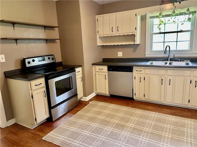 1468 Spruce Dr SE, Smyrna, GA 30080 - kitchen featuring appliances with stainless steel finishes, a sink, open shelves, and dark countertops
