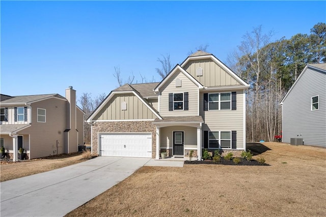 craftsman-style house featuring central AC unit, board and batten siding, concrete driveway, and a garage