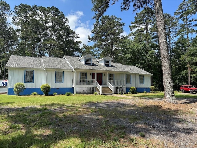 1833 Stephenson Rd, Lithonia, GA 30058 - view of front of property featuring a porch, board and batten siding, a shingled roof, and a front yard