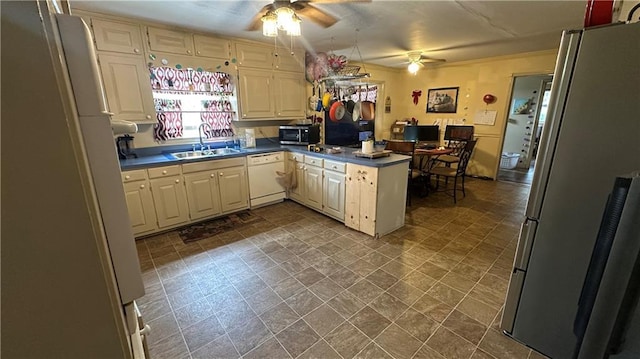 1833 Stephenson Rd, Lithonia, GA 30058 - kitchen featuring white appliances, ceiling fan, a peninsula, a sink, and dark countertops