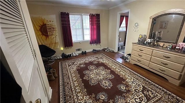 1833 Stephenson Rd, Lithonia, GA 30058 - bedroom with arched walkways, ornamental molding, wood finished floors, baseboards, and connected bathroom