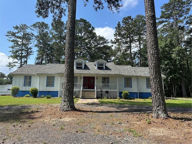 1833 Stephenson Rd, Lithonia, GA 30058 - view of front facade with board and batten siding, a porch, a shingled roof, and crawl space