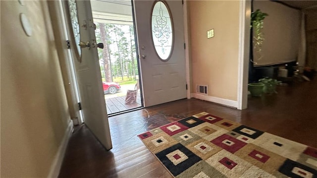 1833 Stephenson Rd, Lithonia, GA 30058 - foyer entrance featuring baseboards and dark wood-style flooring