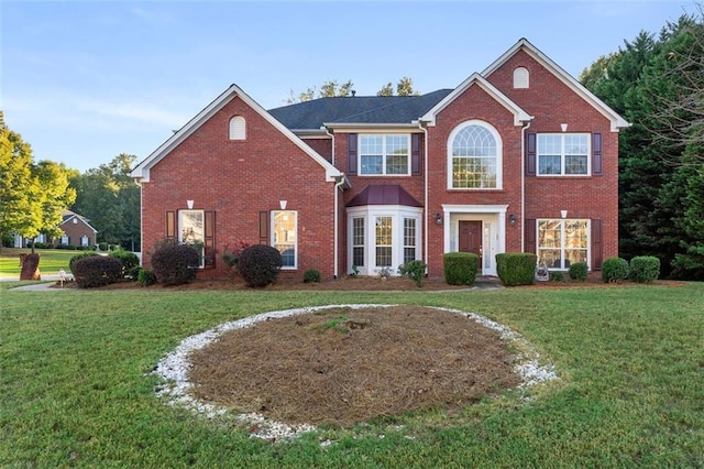 view of front of property with a front lawn