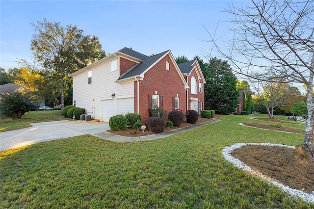 view of side of property featuring central air condition unit, a lawn, and a garage