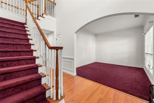 stairway with hardwood / wood-style floors