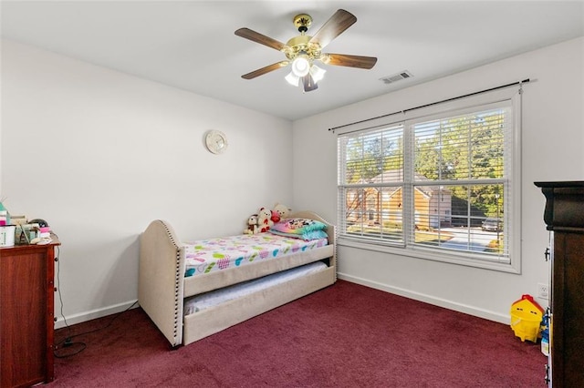 carpeted bedroom featuring ceiling fan