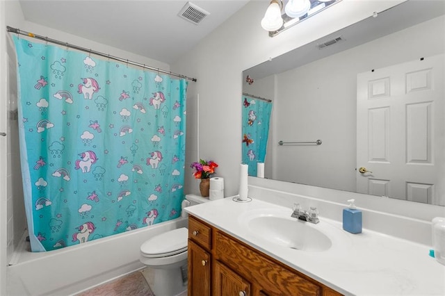 full bathroom with vanity, toilet, tile patterned floors, and shower / bath combo with shower curtain