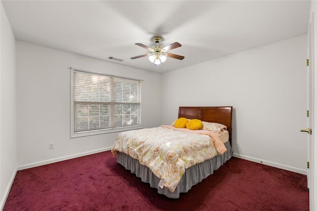 bedroom featuring dark carpet and ceiling fan