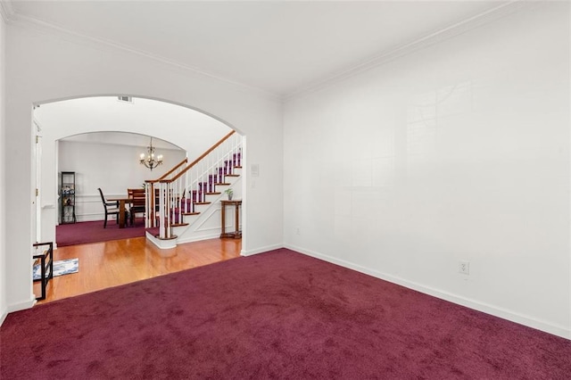 interior space featuring crown molding and a chandelier