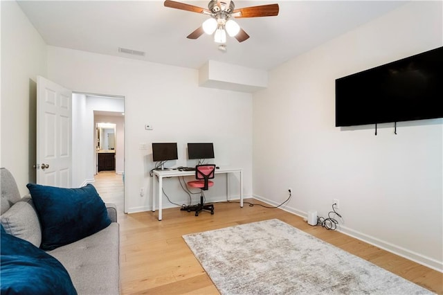 home office featuring ceiling fan and wood-type flooring