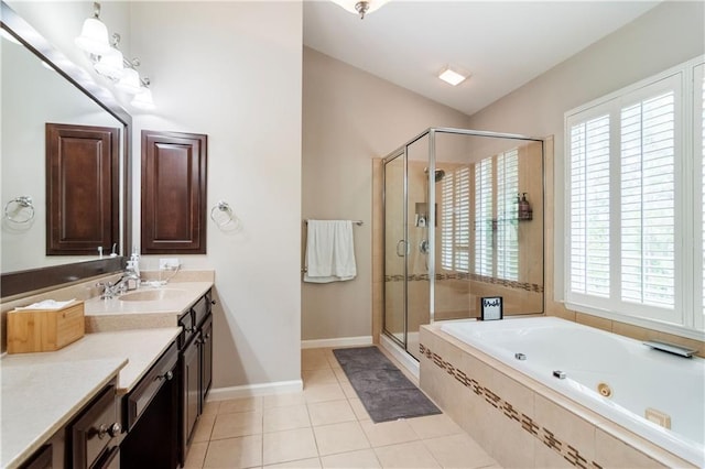 bathroom with tile patterned flooring, vanity, and independent shower and bath