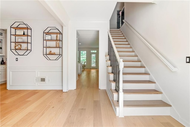 stairway featuring hardwood / wood-style flooring