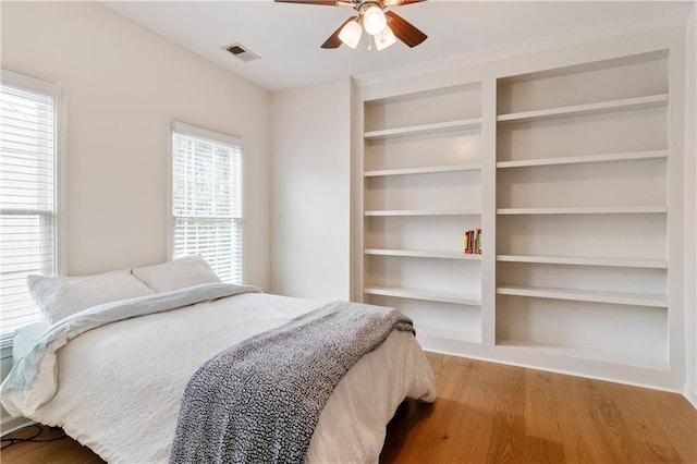 bedroom featuring light wood-type flooring and ceiling fan