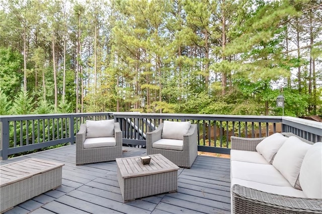 wooden terrace with an outdoor hangout area