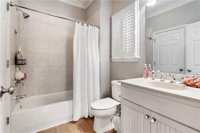 full bathroom with shower / bathtub combination with curtain, crown molding, hardwood / wood-style floors, toilet, and vanity