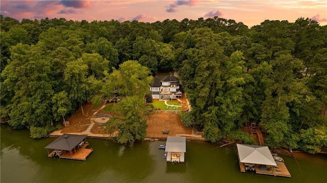 aerial view at dusk with a water view