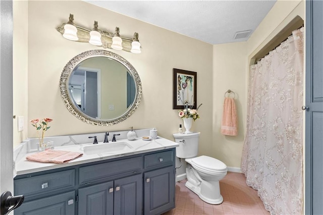 full bath featuring toilet, visible vents, baseboards, vanity, and tile patterned floors