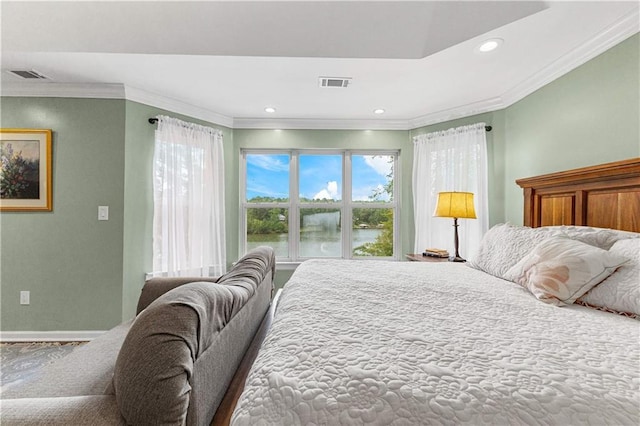 bedroom with ornamental molding, visible vents, and recessed lighting