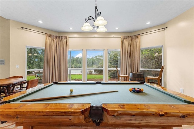 game room featuring a healthy amount of sunlight, a notable chandelier, and recessed lighting